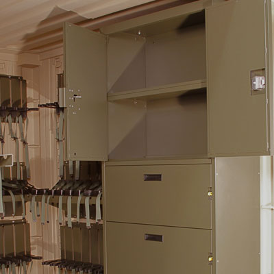 Cabinet storage in tricon for mobilized arms room
